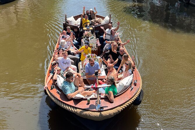 Amsterdam Luxury Boutique Boat tour with Unlimited Beer and Wine - A quick Amsterdam orientation ride (that also lets you drink)