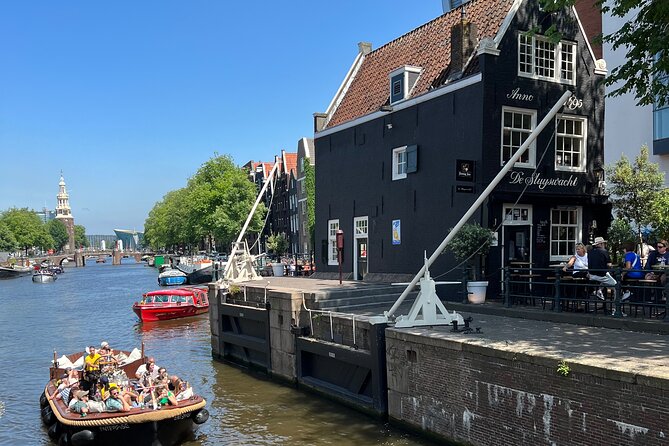 Amsterdam Luxury Boutique Boat tour with Unlimited Beer and Wine - Boat setup matters: open-air expectations vs covered reality
