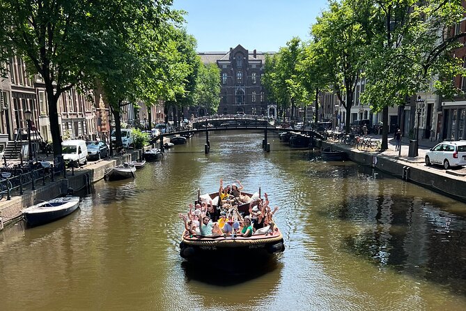Amsterdam Luxury Boutique Boat tour with Unlimited Beer and Wine - Getting on board near Oudezijds Voorburgwal