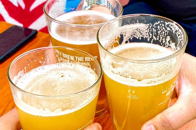Bucharest: Craft Beer Tour with Traditional Meal Included - The food and beer lineup: covrig, mici, and three pours